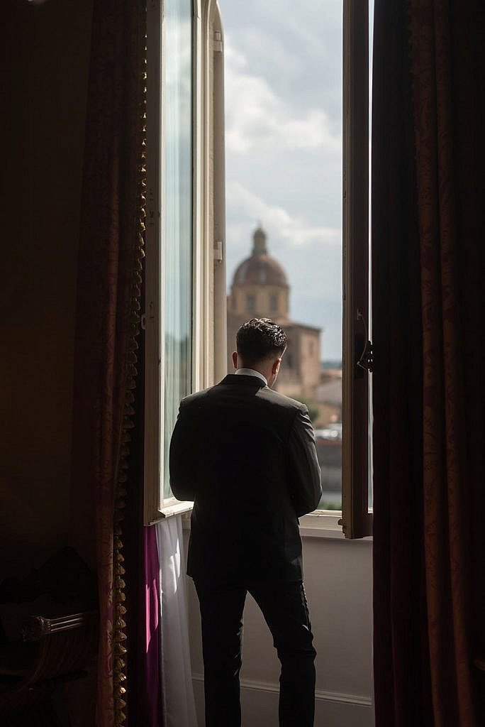 groom relaxing during his real destination wedding at westin exclesior florence