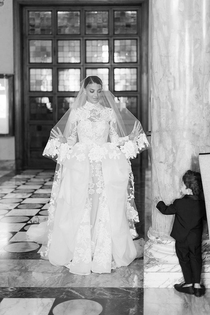 bride and her ring holder a moment before reaching the wedding ceremony in florence