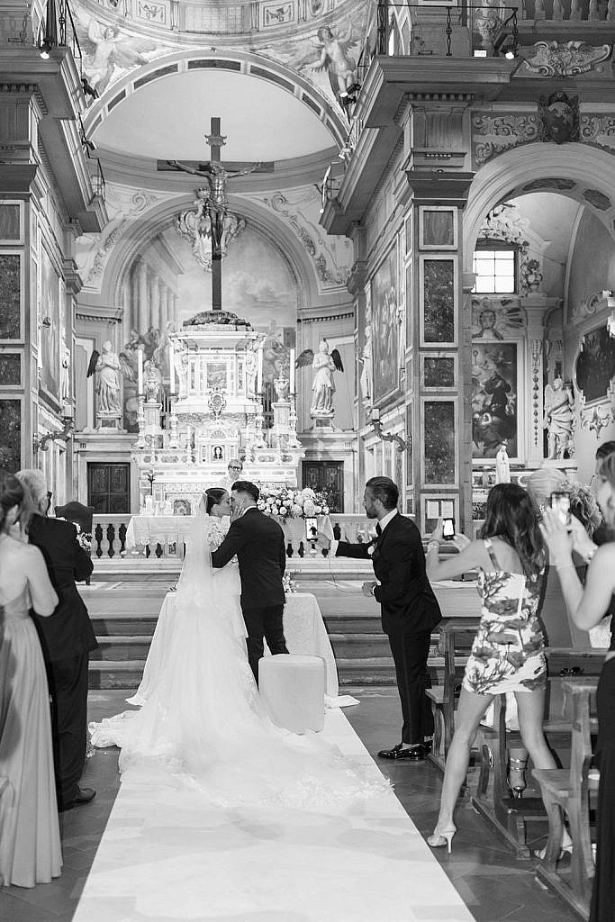 bride and her groom during their elegant catholic wedding ceremony at ognissanti