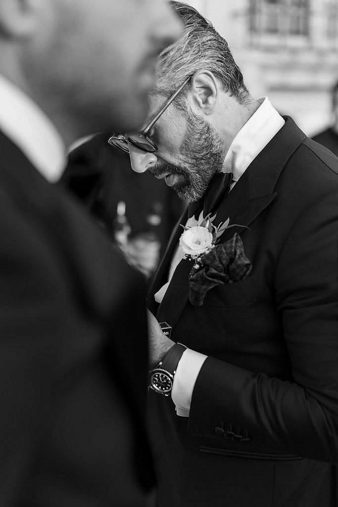 candid photo of the best man and the room after the wedding ceremony in florence