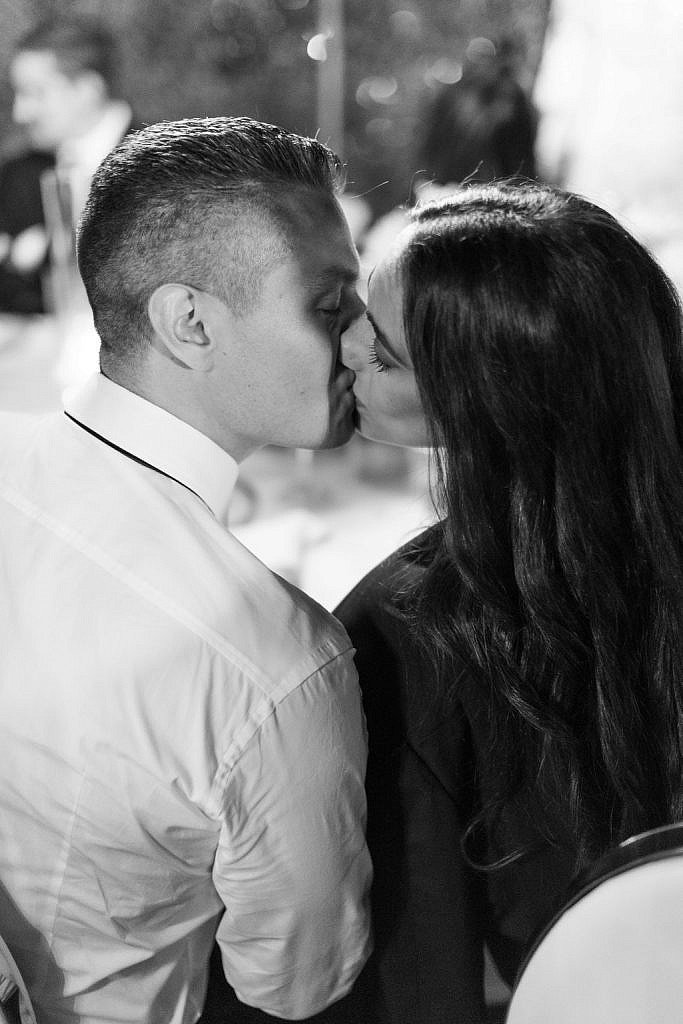guests kissing during a wedding dinner in florence