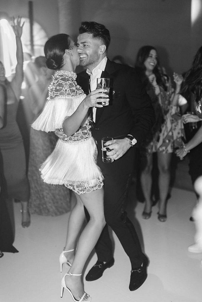 bride and groom enjoying their dancing during their wedding party in villa gamberaia in florence