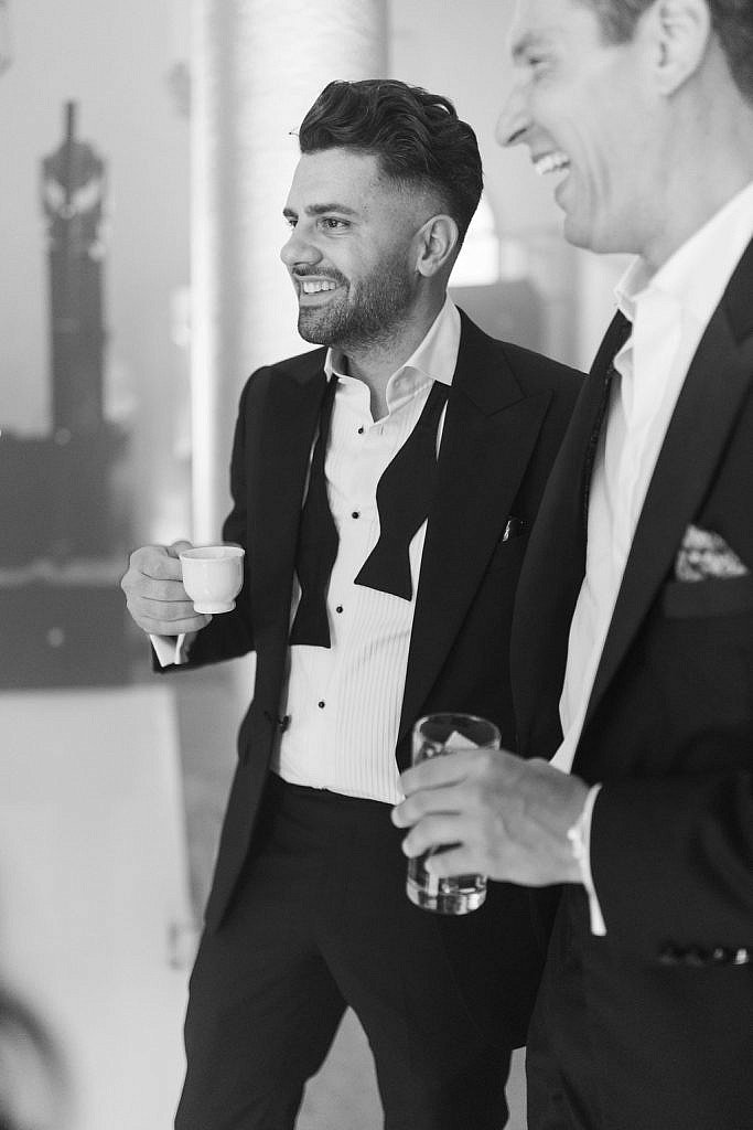 groom having a break with a coffee during his dancing wedding party in florence