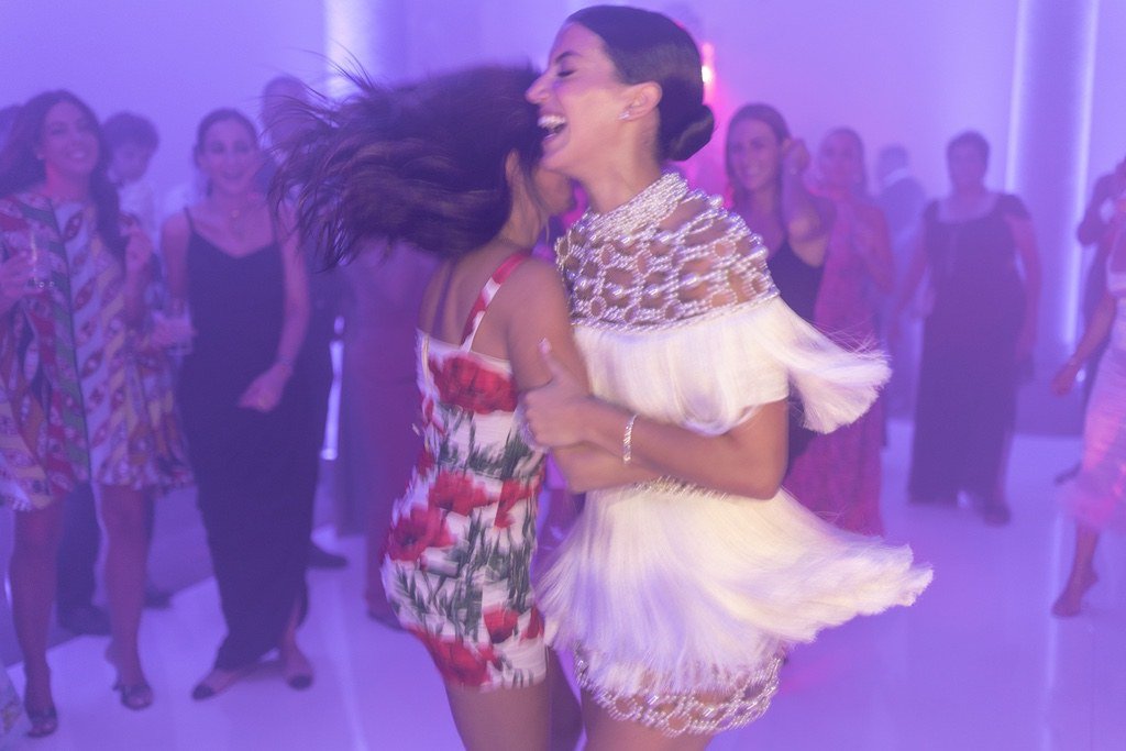 bride and her girlfriend dancing during the wedding party in villa gamberaia