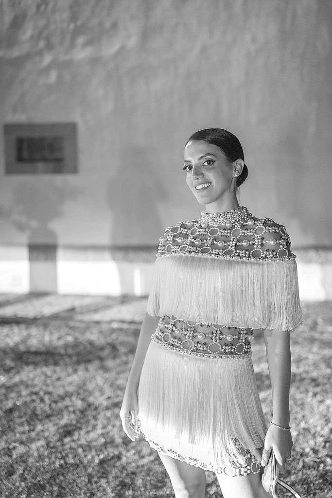 bride wearing her pearl and fringe mini dress di patbo during her luxury wedding party
